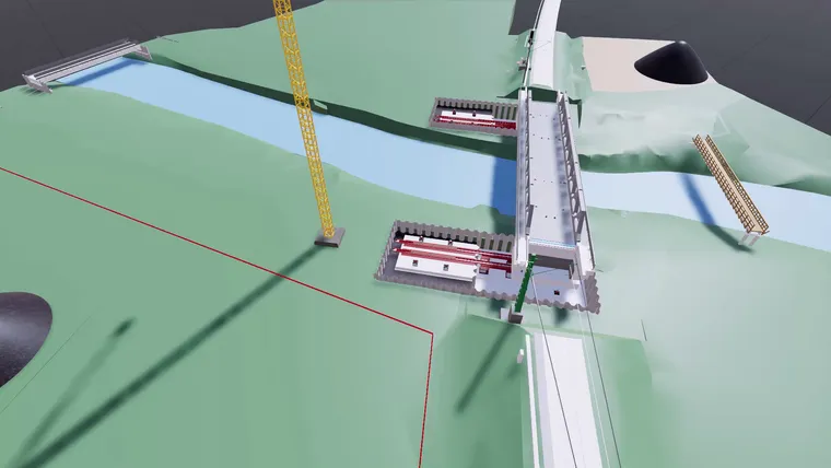 Simulationsmodell der Brücke mit den roten Verschubeinrichtungen in den Baugruben beidseits des Flusses
